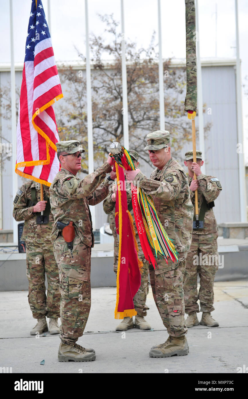 BAGRAM AIRFIELD, AFGHANISTAN (Nov. 29, 2016) - U.S. Army Lt. Col. Edward 'Keith' Rowsey and Command Sgt. Maj. Matthew R. Boehme case the colors of the 63th Ordnance Battalion (Explosive Ordnance Disposal) in preparation for their redeployment to Fort Drum, N.Y.  The 63rd EOD transferred its Task Force EOD mission to the 184th EOD Bn. in a ceremony held here today.  Photo by Bob Harrison, U.S. Forces Afghanistan Public Affairs. Stock Photo