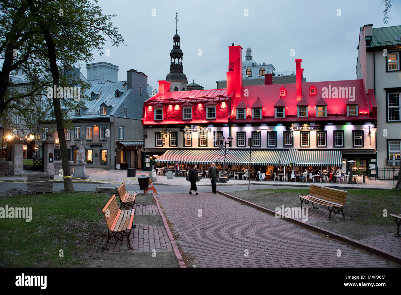Evening illumination and night-life in the Place d'Armes and Rue Sainte-Anne, Quebec City, Canada Stock Photo
