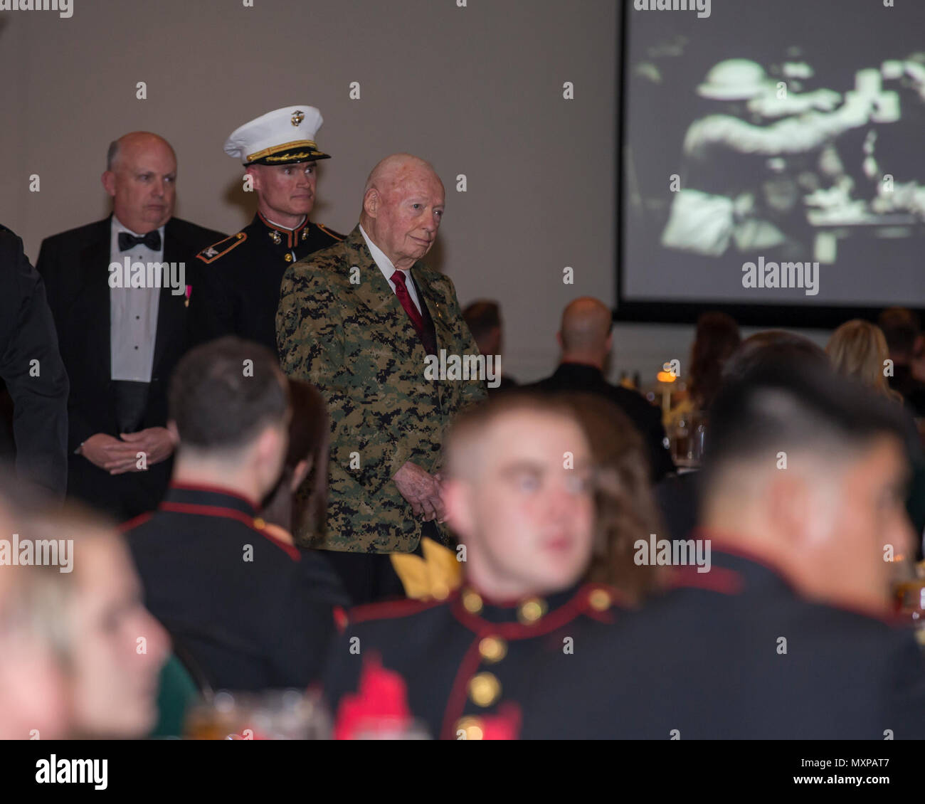 U.S. Marine Corps Gen. Alfred Gray (ret.), 29th Commandant of the Marine Corp, watches the birthday message of the 37th Commandant of the Marine Corp Gen. Robert Neller at Marine Corps Intelligence Activity's 241st Marine Corps birthday ball ceremony at the Fredericksburg Expo and Conference Center in Fredericksburg, Va., Nov. 10, 2016. The Continental Marines were established on this date in 1775, and the United States Marine Corps celebrates every year with a traditional birthday ball and cake-cutting ceremony. (U.S. Marine Corps photo by Cpl. Jacqueline A. Garcia) Stock Photo