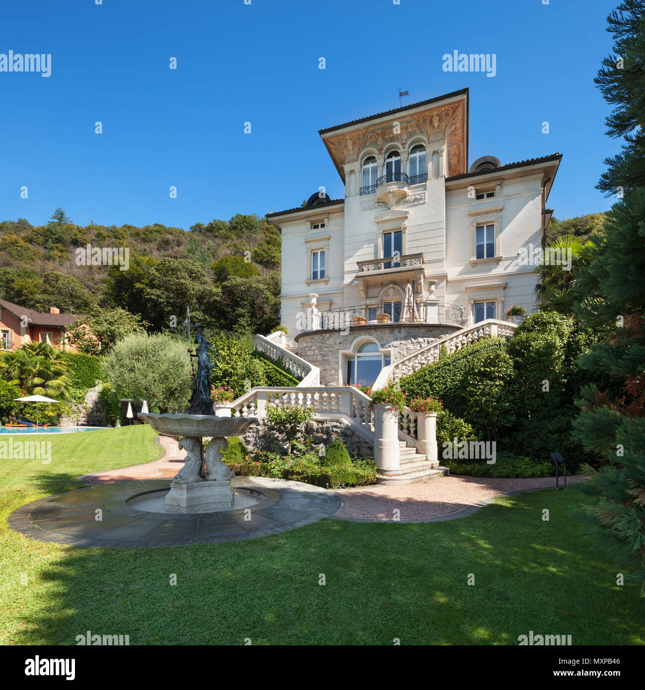 beautiful classical mansion surrounded by a park, outdoors Stock Photo