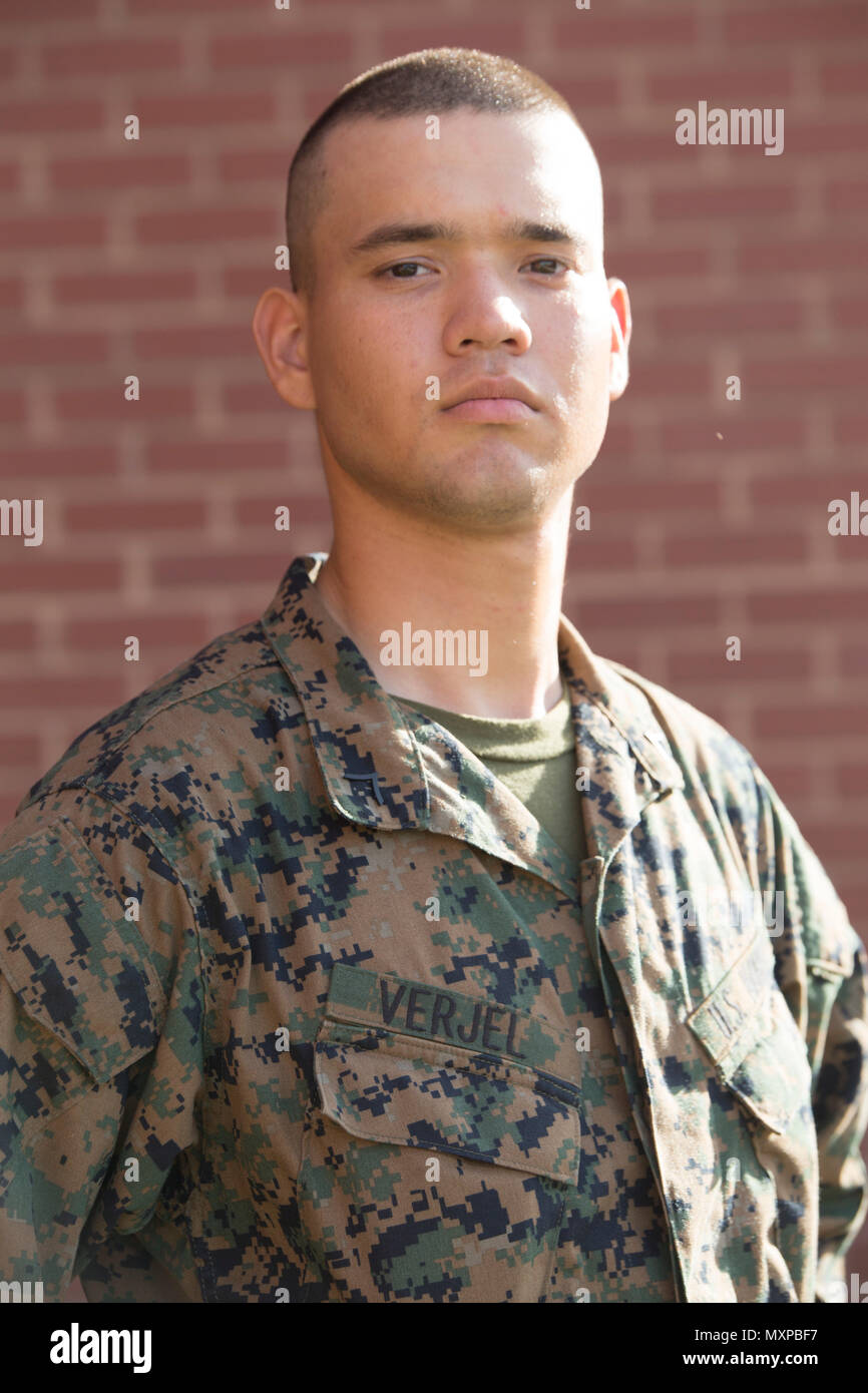 Pfc. Jesus M. Verjel, Platoon 2088, Echo Company, 2nd Recruit Training Battalion, earned U.S. citizenship Dec. 1, 2016, on Parris Island, S.C. Before earning citizenship, applicants must demonstrate knowledge of the English language and American government, show good moral character and take the Oath of Allegiance to the U.S. Constitution. Verjel, from Queens, N.Y., originally from Colombia, is scheduled to graduate Dec. 2, 2016. (Photo by Lance Cpl. Aaron Bolser) Stock Photo