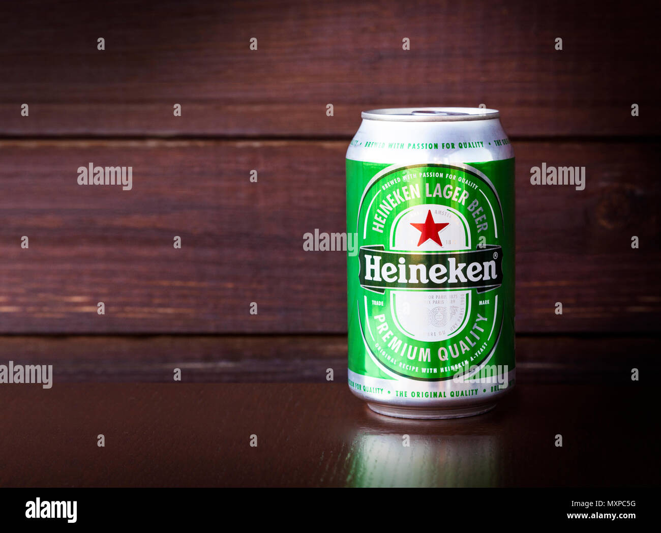 Heineken beer in an aluminium can, on wooden background Stock Photo