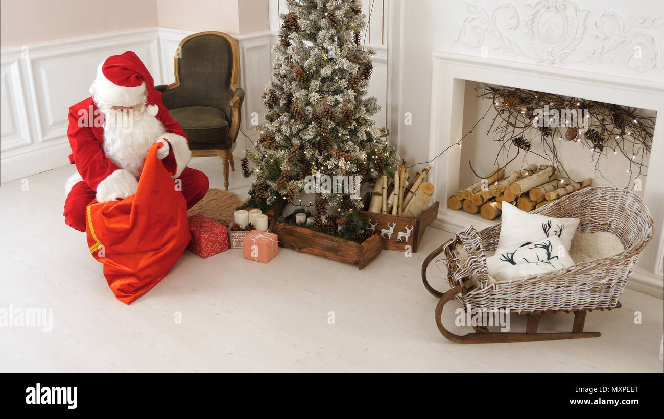 Joyful santa delivering gifts hi-res stock photography and images - Alamy