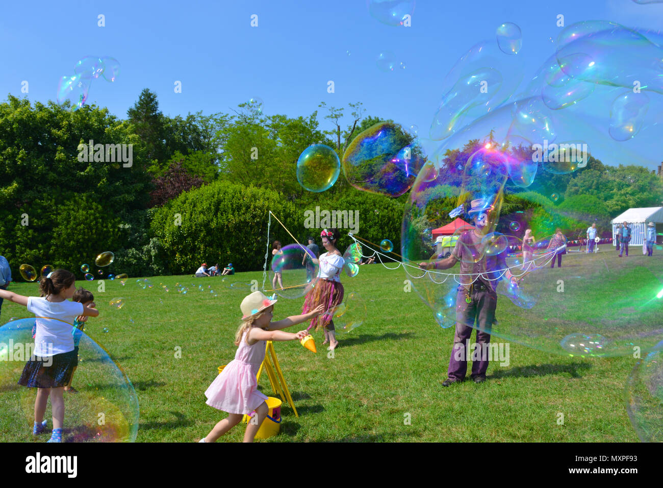 Bubblemania making soap bubbles to entertain the crowds at the annual Sherborne Castle Country Fair, Sherborne, Dorset, England. Stock Photo
