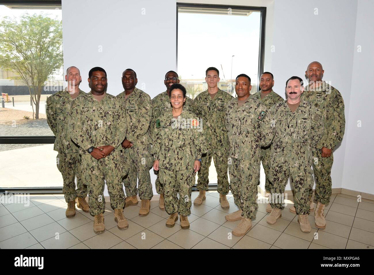 161121-N-HX127-128 161121-N-XO780-127 CAMP LEMONNIER (Nov. 21, 2016) Commander, U.S. Naval Forces Europe-Africa /Commander, Allied Joint Force Command Naples, Adm. Michelle Howard, center, and U.S. Naval Forces Europe-Africa Fleet Master Chief Raymond D. Kemp Sr., right rear, meet with Sailor of the Year winners from Coastal Riverine Squadron 11 and Combined Joint Task Force, Horn of Africa Nov. 21, 2016. U.S. Naval Forces Europe-Africa, headquartered in Naples, Italy, oversees joint and naval operations, often in concert with allied, joint, and interagency partners, to enable enduring relatio Stock Photo