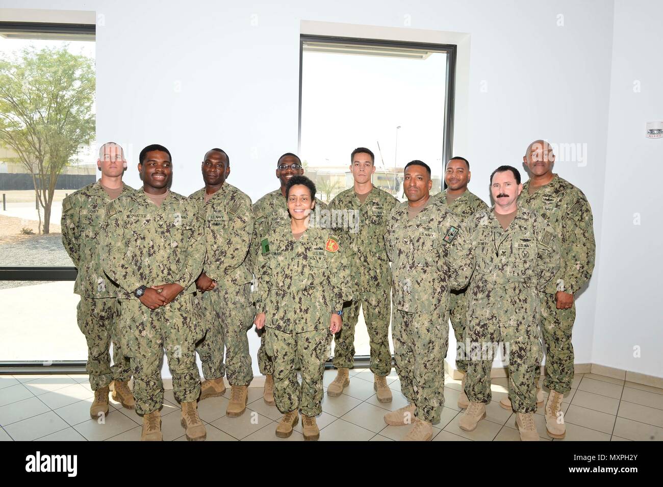 161121-N-HX127-127 CAMP LEMONNIER (Nov. 21, 2016) Commander, U.S. Naval Forces Europe-Africa /Commander, Allied Joint Force Command Naples, Adm. Michelle Howard, center, and U.S. Naval Forces Europe-Africa Fleet Master Chief Raymond D. Kemp Sr., right rear, meet with Sailor of the Year winners from Coastal Riverine Squadron 11 and Combined Joint Task Force, Horn of Africa Nov. 21, 2016. U.S. Naval Forces Europe-Africa, headquartered in Naples, Italy, oversees joint and naval operations, often in concert with allied, joint, and interagency partners, to enable enduring relationships, and increas Stock Photo