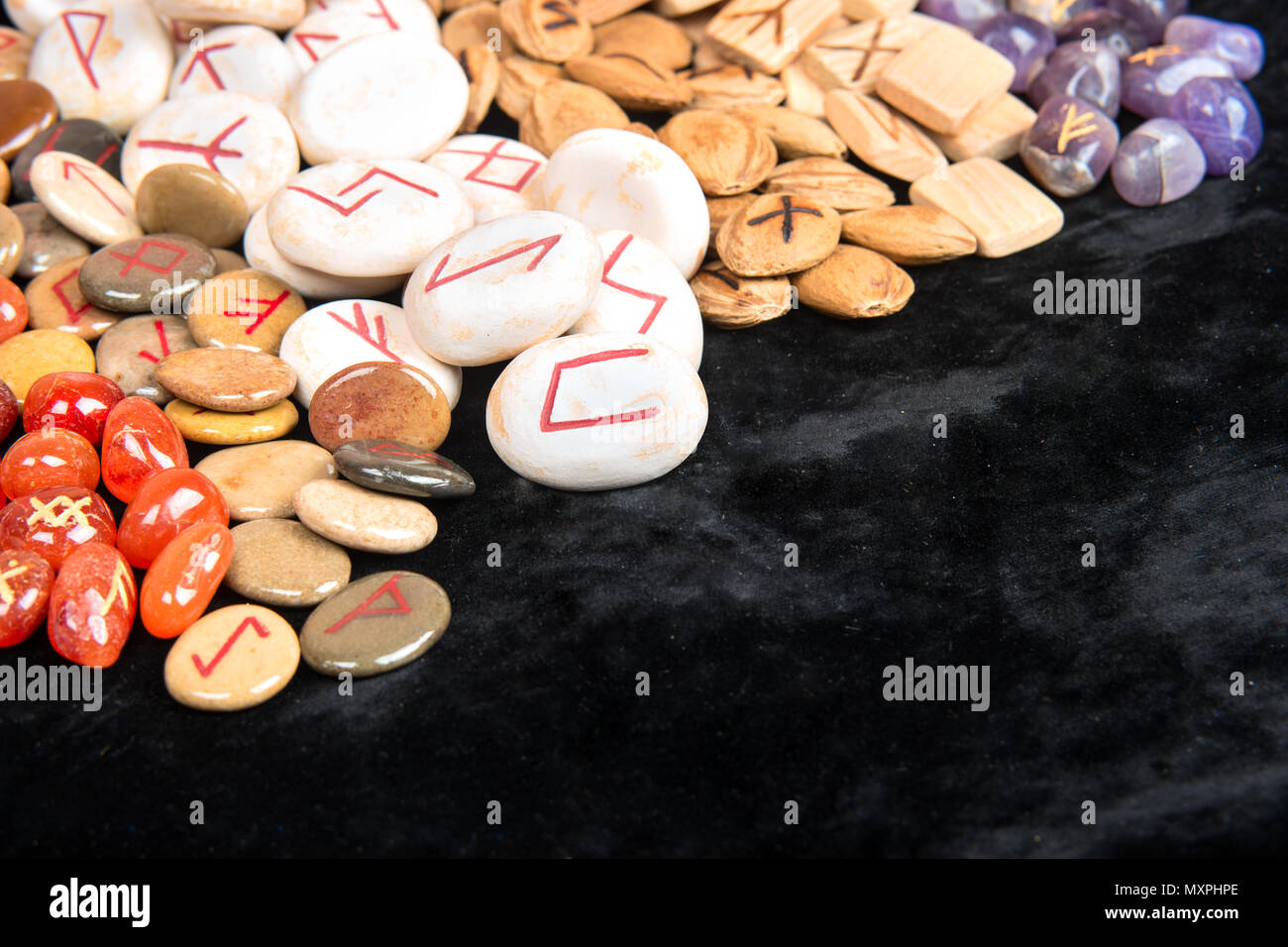 Scattered magic runes made of different materials closeup Stock Photo ...