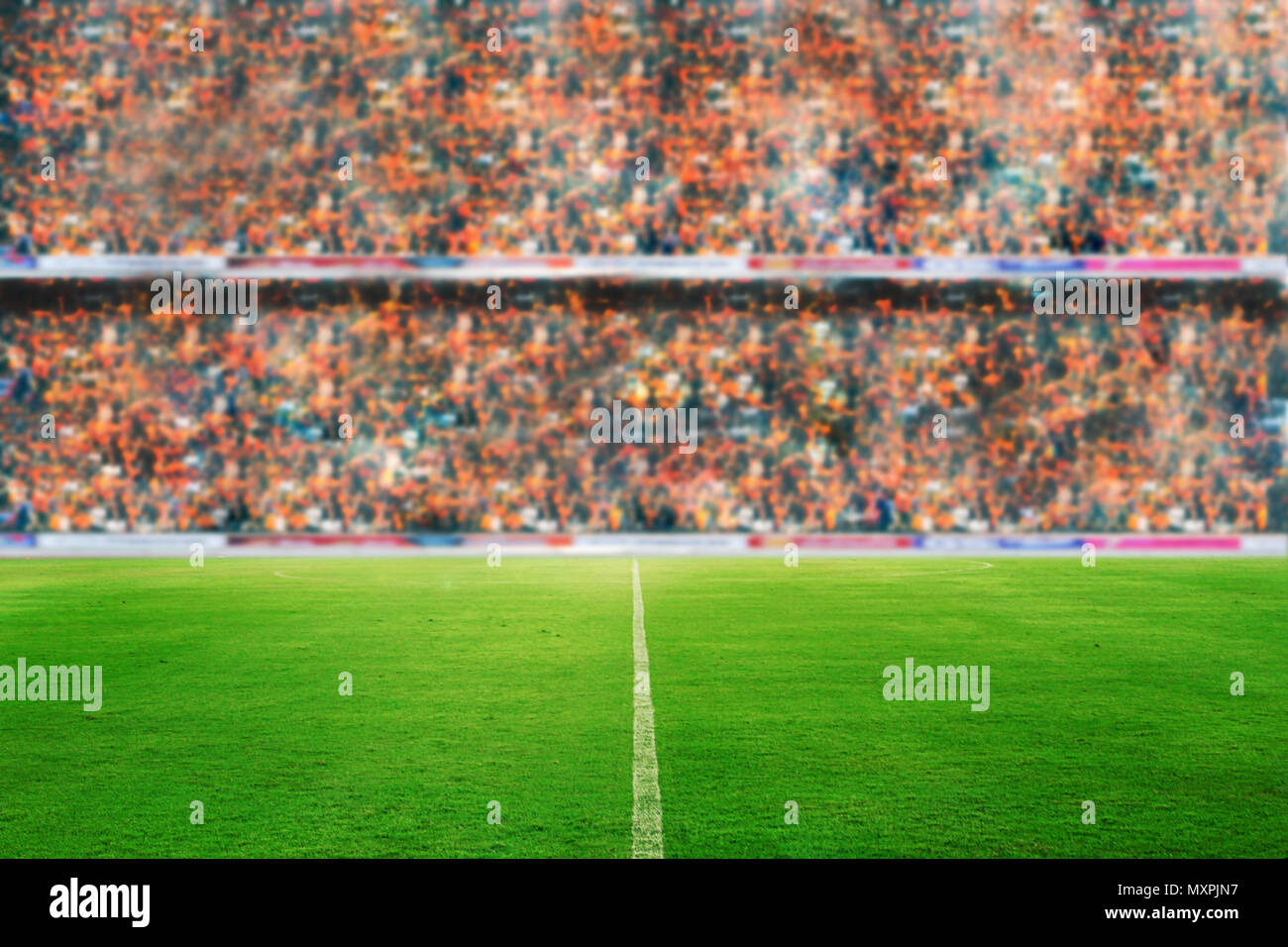 blurry and soft focus of football stadium and arena soccer field championship win for background