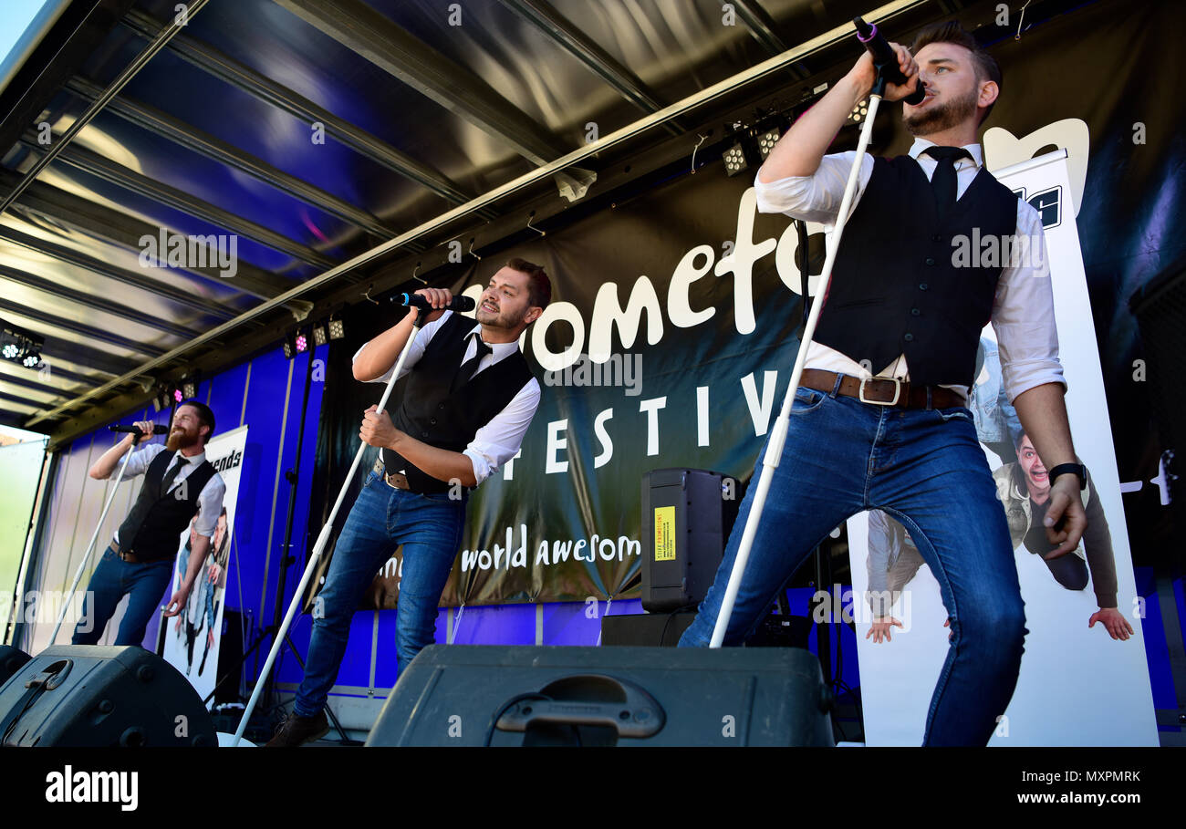 Legends, a 3-piece Boy Band Tribute, performing at the Petersfield Spring Festival, The Square, Petersfield, Hampshire, UK. Stock Photo