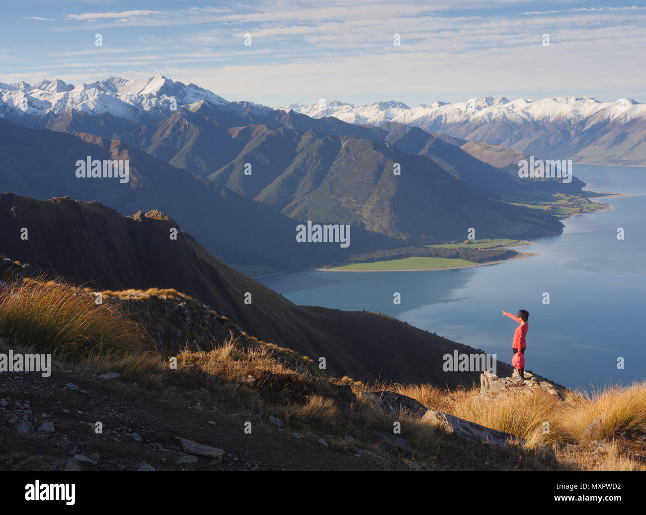 Young woman viewing mountain landscape in New Zealand Isthmus peak Stock Photo