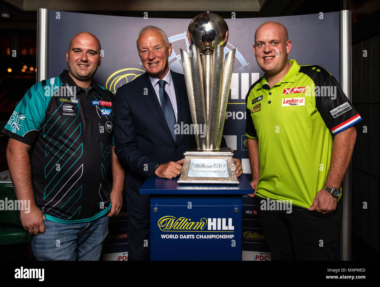 Current William Hill World Champion Rob Cross (left), chairman of Matchroom  sport Barry Hearn (centre) and current world no.1 Michael van Gerwen pose  during the photocall at Smith & Wollensky Restaurant, London
