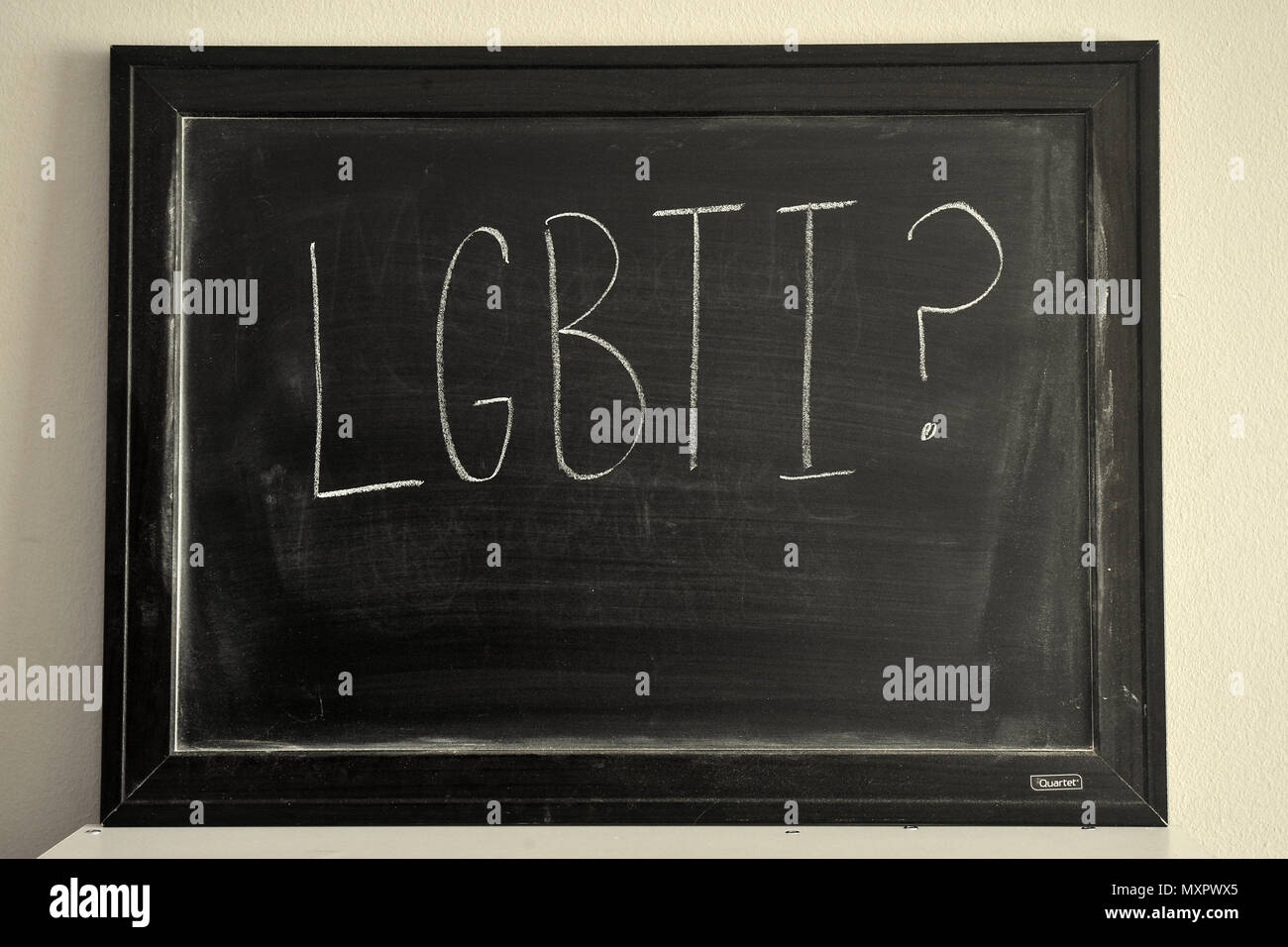 LGBTI written in white chalk on a blackboard. Stock Photo