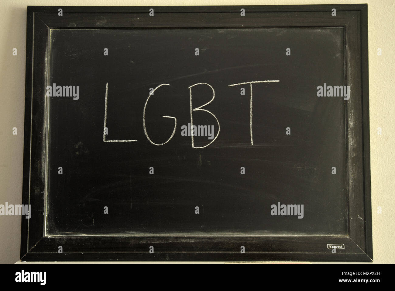 LGBT written in white chalk on a blackboard Stock Photo