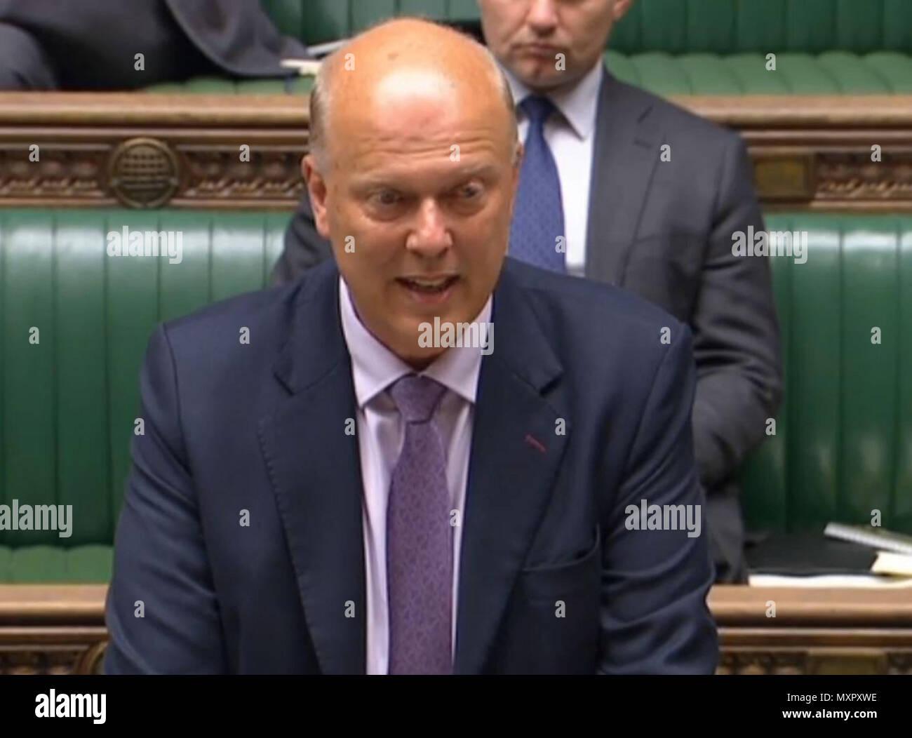 transport Secretary Chris Grayling speaking in the House of Commons in central London about the new train timetables which have caused major disruptions. Stock Photo