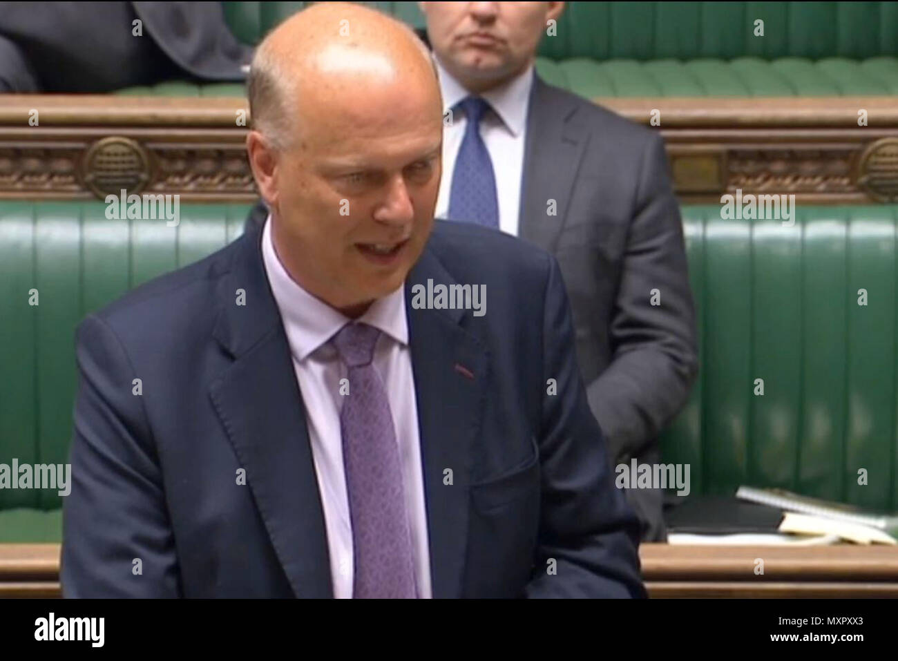 Transport Secretary Chris Grayling speaking in the House of Commons in central London about the new train timetables which have caused major disruptions. Stock Photo