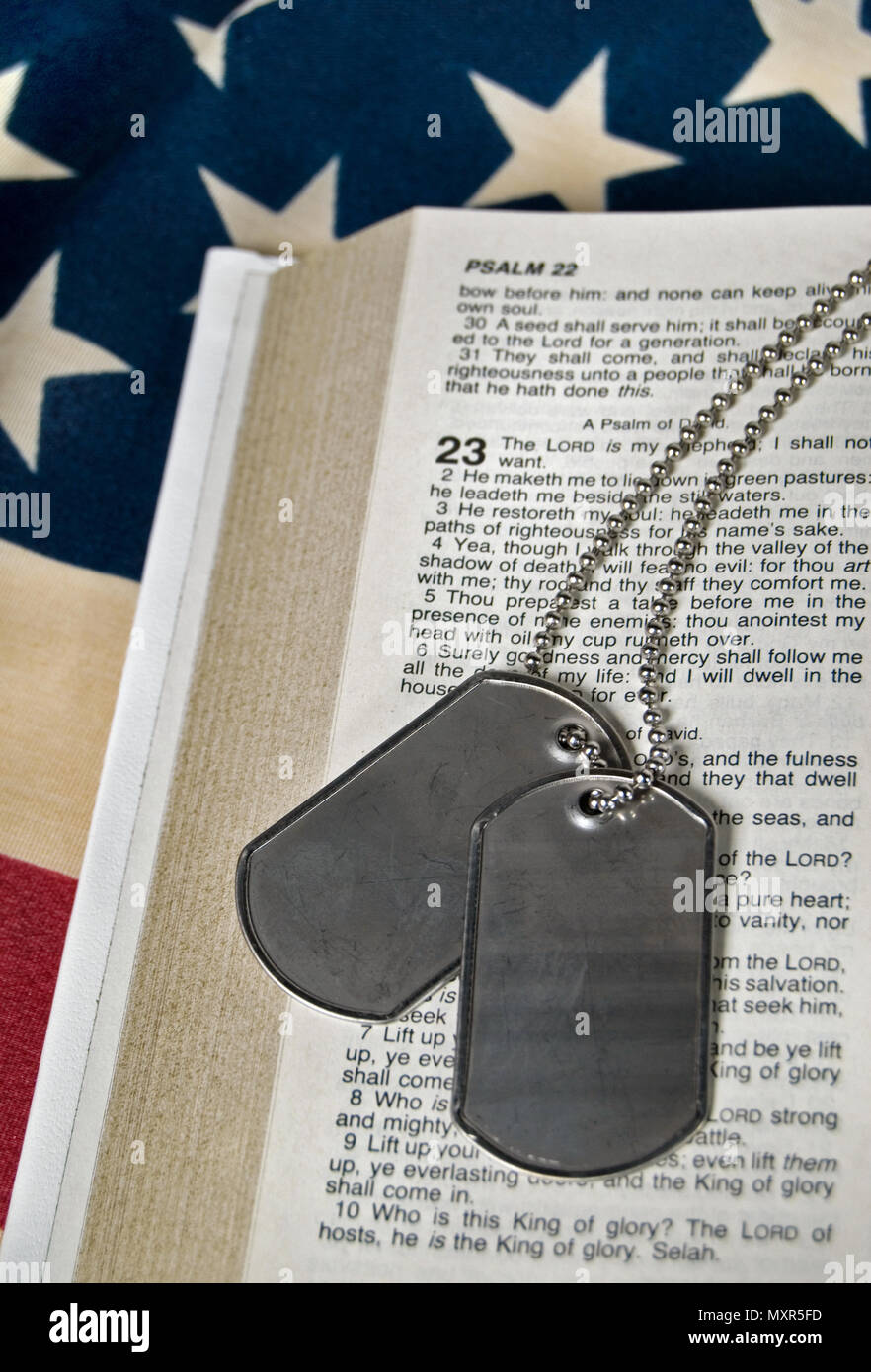 Military dog tags on Holy Bible opened to Psalm 23 Stock Photo