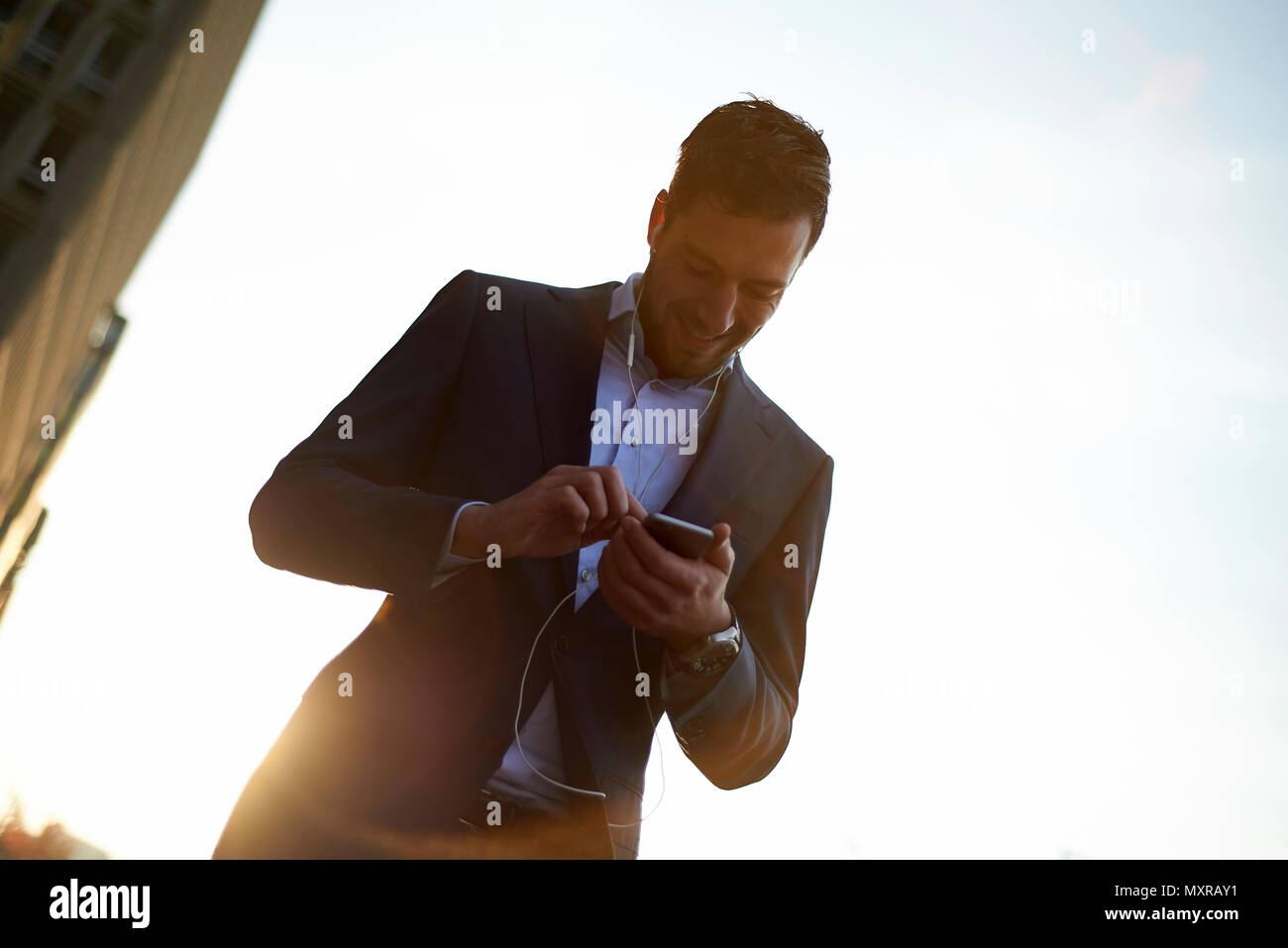 Man in headphones walks hi-res stock photography and images - Alamy