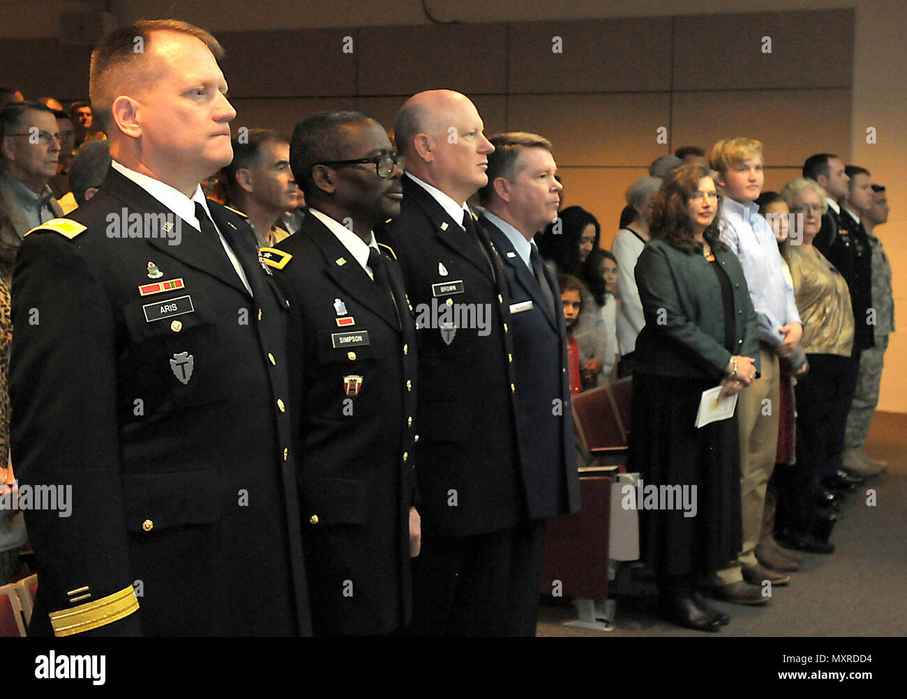 Col. Charles 'Chuck' Aris, 36th Infantry Division Assistant Division Commander of Support, Maj. Gen. Leslter Simpson, 36th Infantry Division Commanding General, Maj. General James K. 'Red' Brown, U.S. Forces Command Deputy Commanding General - Reserve Component, Maj. Gen. Jogn Nichols, Texas Military Department Adjutant General, stand for the National Anthem during the promotion of Aris from Col. to Brig. Gen. on Sunday, Dec. 4, 2016, at Camp Mabry, Austin, Texas. He is joined by family, friends and colleagues to celebrate his promotion at a ceremony and following reception at the Texas Milita Stock Photo