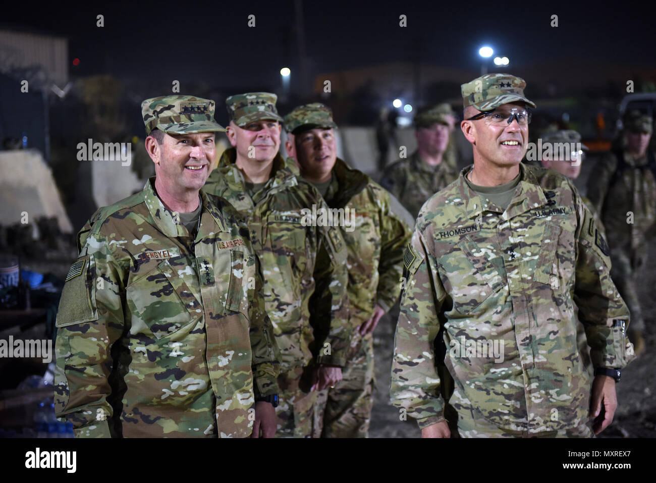 Air Force Gen. Joseph Lengyel, chief, National Guard Bureau; Army Lt. Gen. Timothy Kadavy, director, Army National Guard; Air Force Chief Master Sgt. Mitchell Brush, senior enlisted advisor to the chief of the National Guard Bureau; and Army Maj. Gen. John Thomson, commanding general, 1st Cavalry Division, watch toops play a flag footbal game during a Thanksgiving troop visit, Bagram Airfield, Bagram, Afghanistan, Nov. 23, 2016. (U.S. Army National Guard photo by Sgt. 1st Class Jim Greenhill) Stock Photo