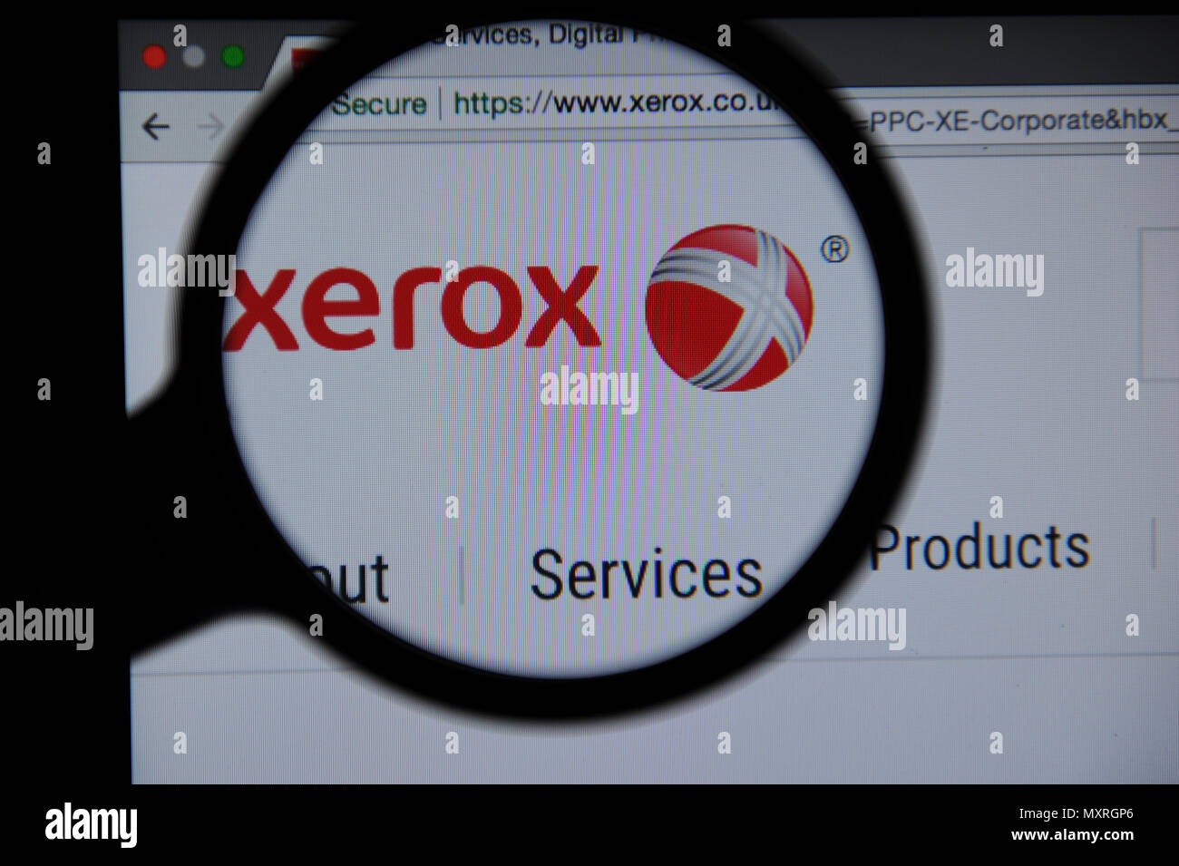Xerox website seen through a magnifying glass Stock Photo