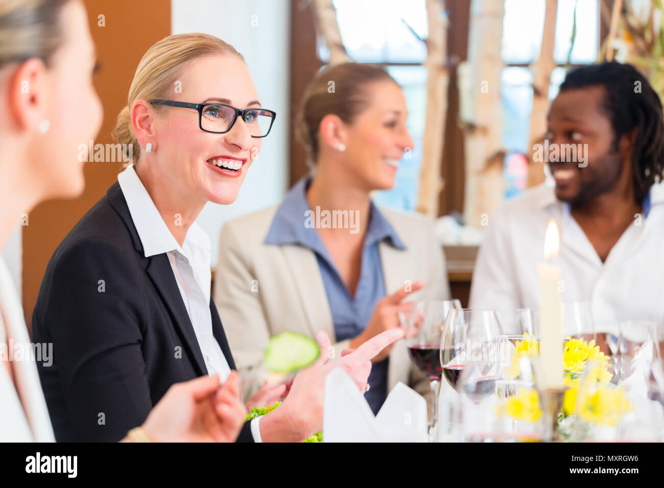 Business lunch in restaurant with food and wine Stock Photo