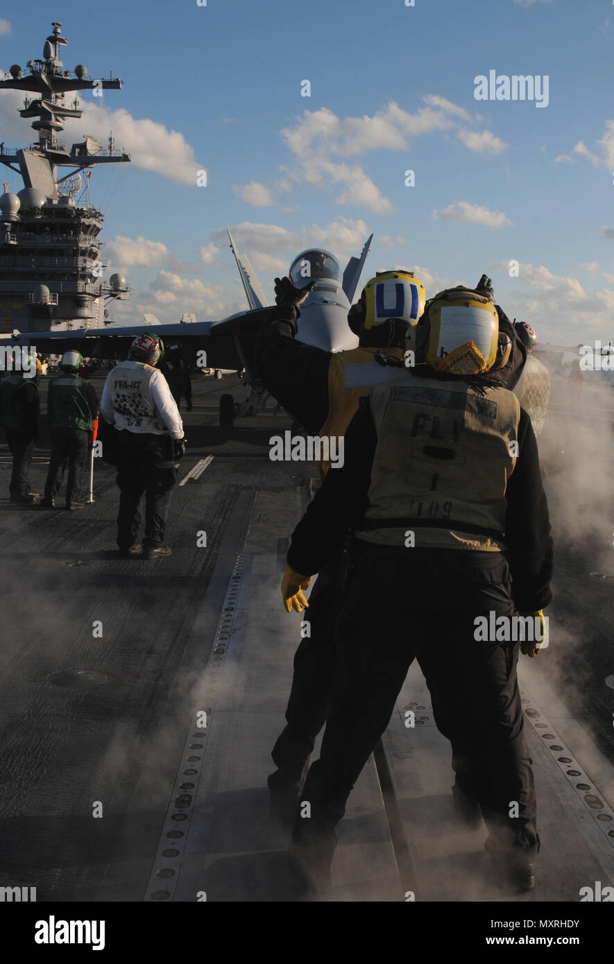 161202-N-JU894-166 ATLANTIC OCEAN (Dec. 2, 2016) Sailors direct an F/A-18E Super Hornet towards the catapult for take off on the flight deck aboard the aircraft carrier USS George H.W. Bush (CVN 77). GHWB is underway conducting a Composite Training Unit Exercise (COMPTUEX) with the George H.W. Bush Carrier Strike Group in preparation for an upcoming deployment. (U.S. Navy photo by Seaman Brooke Macchietto/Released) Stock Photo