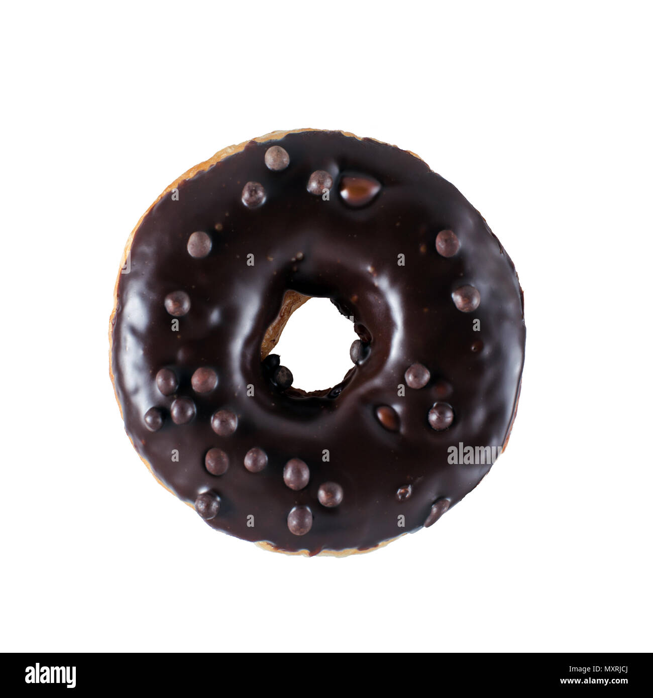 Single chocolate glazed donut with chocolate chips Stock Photo