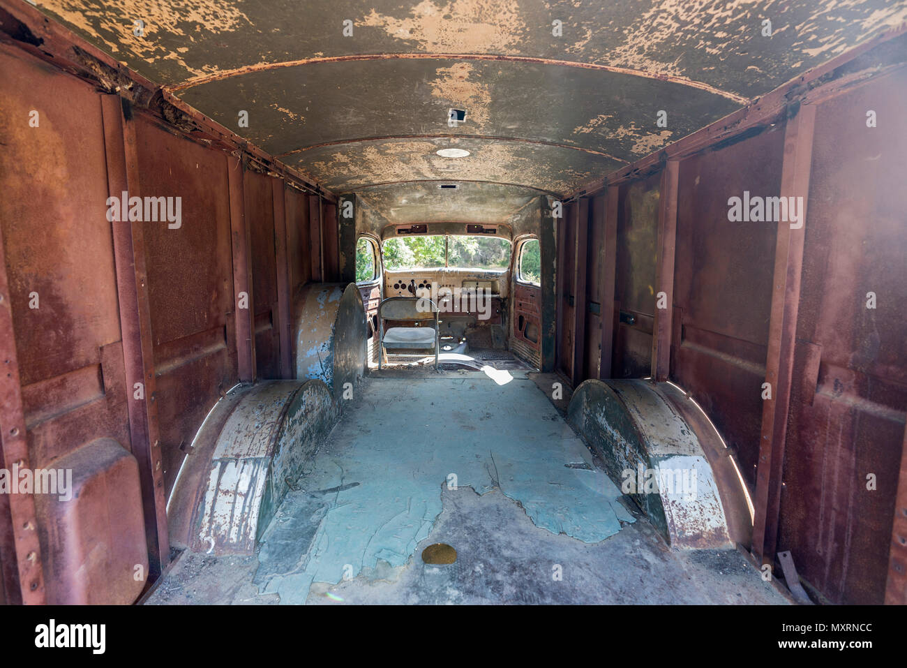 Interior of 1940s vintage ruined and abandoned panel truck. Stock Photo