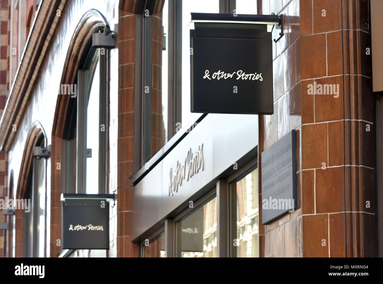 The brand logo of the H&M Group women’s clothing retailer & Other Stories, in Covent Garden, London. Stock Photo