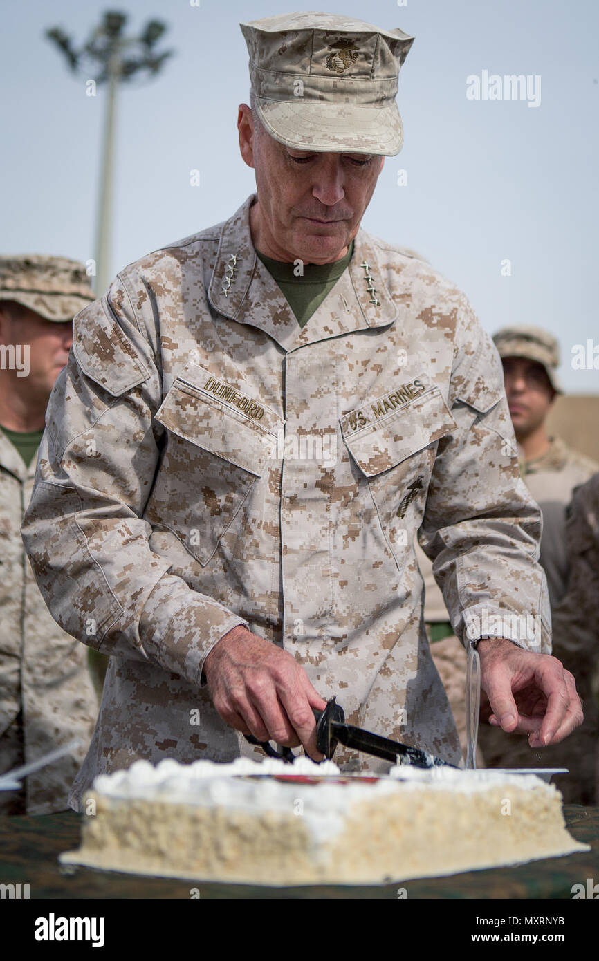 General Joseph Dunford Jr., Chairman of the Joint Chiefs of Staff, cuts a birthday cake during a ceremony in honor of the 241st Marine Corps Birthday with U.S. Marines from Weapons Company, 3rd Battalion, 7th Marine Regiment, Special Purpose Marine Air-Ground Task Force - Crisis Response - Central Command, in Erbil, Iraq, Nov. 10, 2016. SPMAGTF-CR-CC is forward deployed in several host nations, with the ability to respond to a variety of contingencies rapidly and effectively. (U.S. Marine Corps photo by Sgt. Donald Holbert) Stock Photo