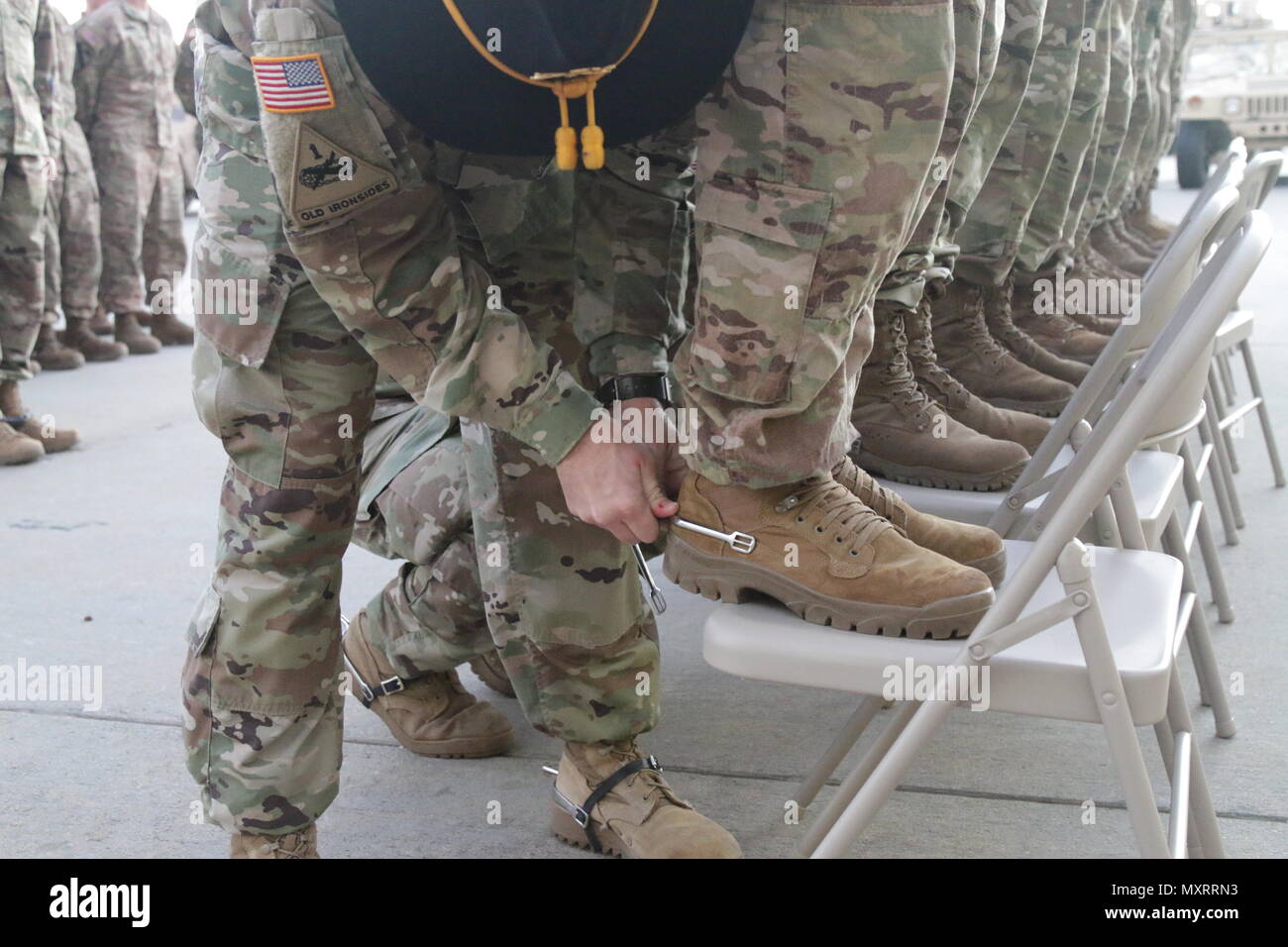 A Soldier with the 5th Squadron, 7th Cavalry Regiment gives awards a