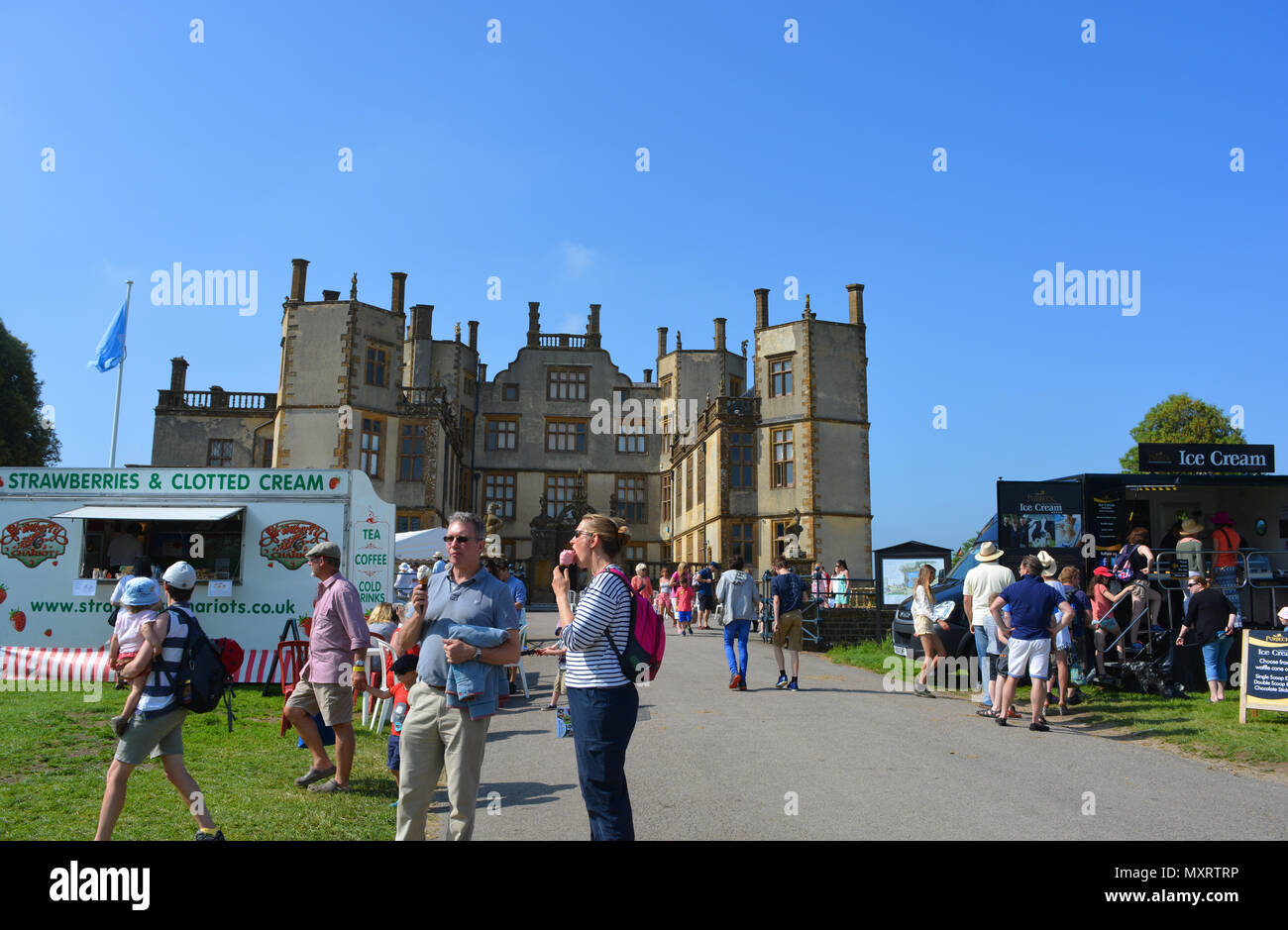 Couple with ice creams at Sherborne Castle Country Fair, Sherborne Castle, Dorset, England Stock Photo