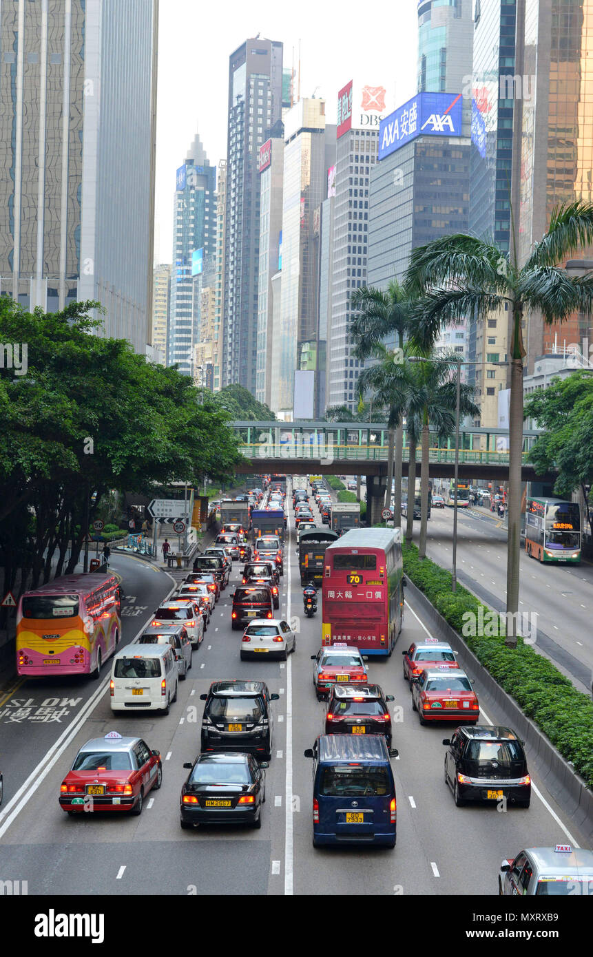Hong Kong. Street scene with traffic, cars and taxis at the bottom of