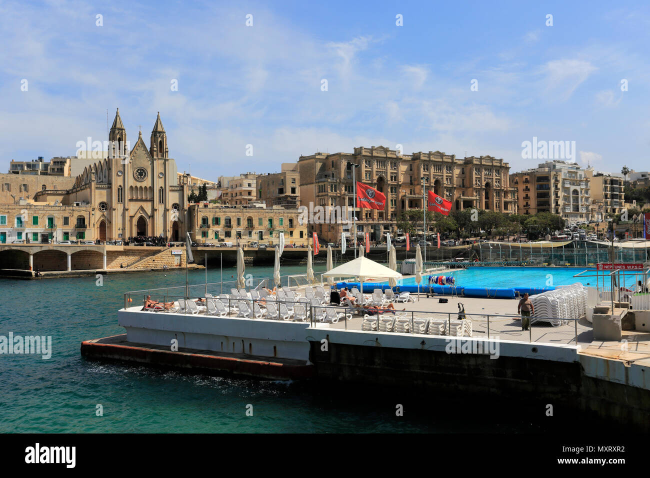 Summer view over St Julians old parish church, St Julians Bay, St Julians town, Malta Stock