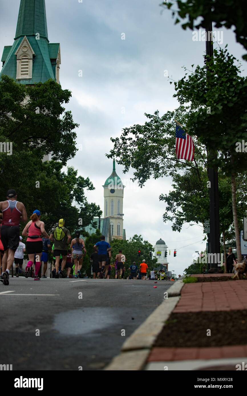 Participants of the 11th Annual Marine Corps Historic Half (MCHH) run the 13.1-mile route from the Fredericksburg Expo Center into the historic downtown areas of Fredericksburg, Va. May 20, 2018, May 20, 2018. The MCHH attracts over 8, 000 participants and includes the Devil Dog Double and Marine Corps Semper 5ive races. (U.S. Marine Corps photo by Lance Cpl. Paige M. Verry). () Stock Photo