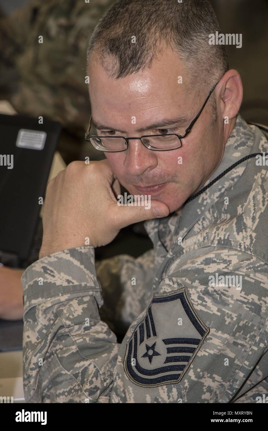 Master, May 16, 2018. Sgt. Branson Bentley, an Information Protection Technician, scans his network for potential threats during Cyber Shield, on Wednesday May 16, at Camp Atterbury, Ind. Cyber Shield 18 is an Army National Guard exercise designed to assess Cyber Warriors on response plans to cyber incidents and features over 800 Soldiers and Airmen. (U.S. Army Photo by Spc. Michael Hunnisett). () Stock Photo