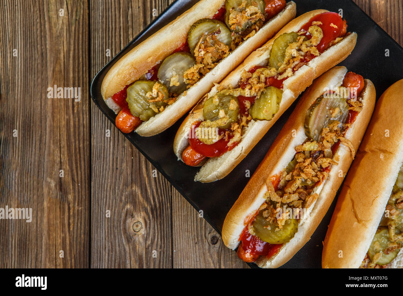 American hot dog with pickles,onions, ketchup and mustard Stock Photo