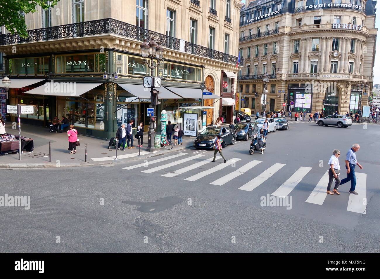 Paris, France. Hot bright sunny spring day, May 2018. Pedestrian crossing in the L’Opera district. Stock Photo