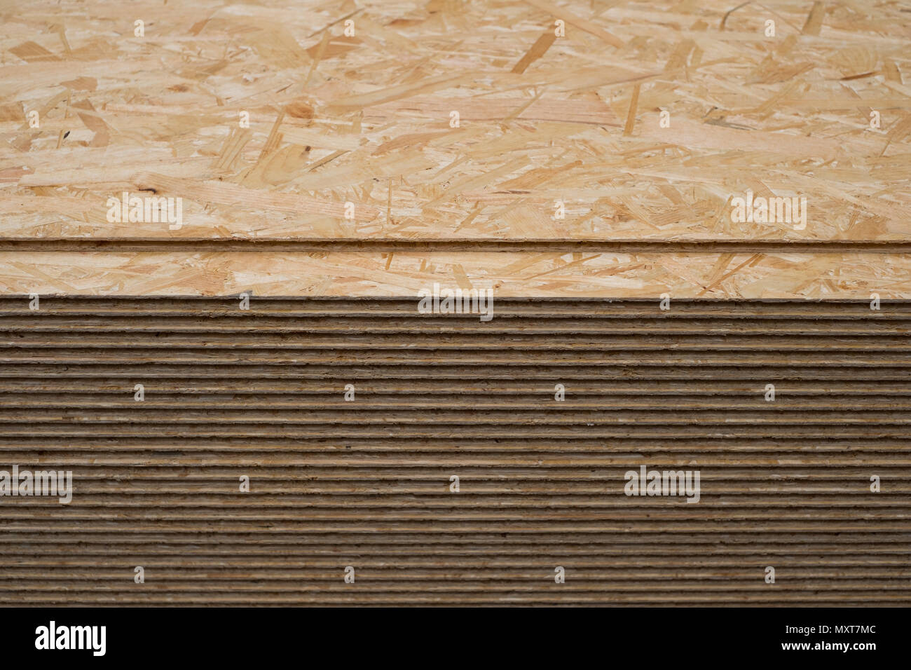 construction wood, osb panel, stacked chipboard planks , plywood  - Stock Photo