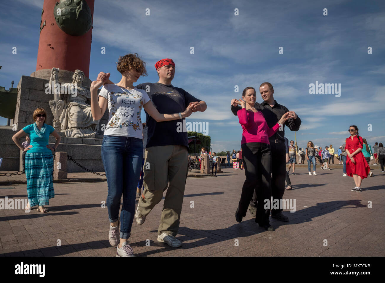 Local residents learn to dance on Birzhevaya Ploschad (Exchange Square) in the center of Saint Petersburg city, Russia Stock Photo