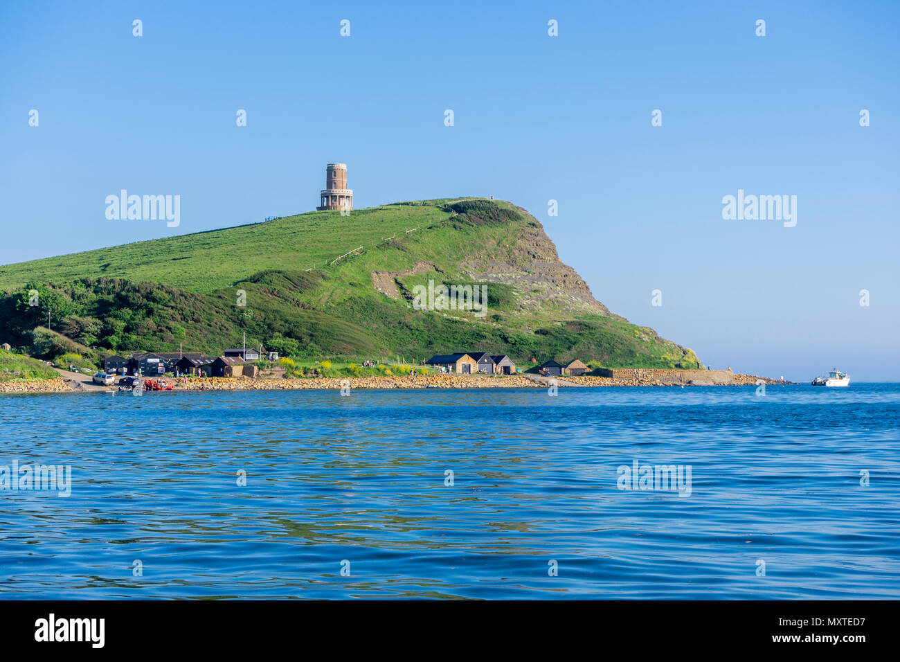 View over Kimmeridge Bay Jurassic Coast World Heritage site to Hen cliff with Clavell Tower on top, Dorset, England, UK Stock Photo