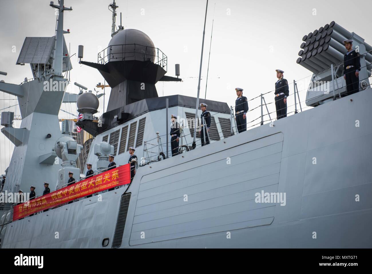 161206-N-VN584-397 SAN DIEGO (Dec. 6, 2016) Chinese sailors on the Jiangkai II-class frigate Yancheng (FFG 546) man the rails as they arrive in San Diego. Rear Adm. Jay Bynum, commander of Carrier Strike Group Nine, is hosting three People’s Liberation Army ships during a routine port visit in San Diego.  (U.S. Navy photo by Seaman Alex Corona/Released) Stock Photo