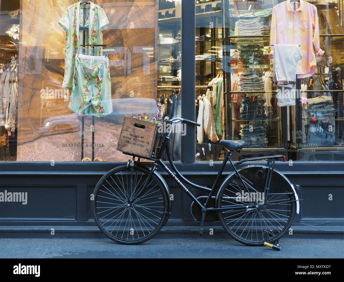 Old bicycle on a sidewalk of Lafayette street in SoHo, New York City Stock Photo