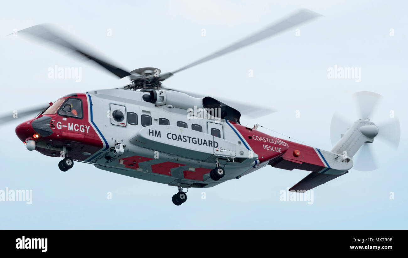 Coastguard Helicopter G-MCGY on exercise with the RNLI in Mounts Bay Cornwall, UK Stock Photo