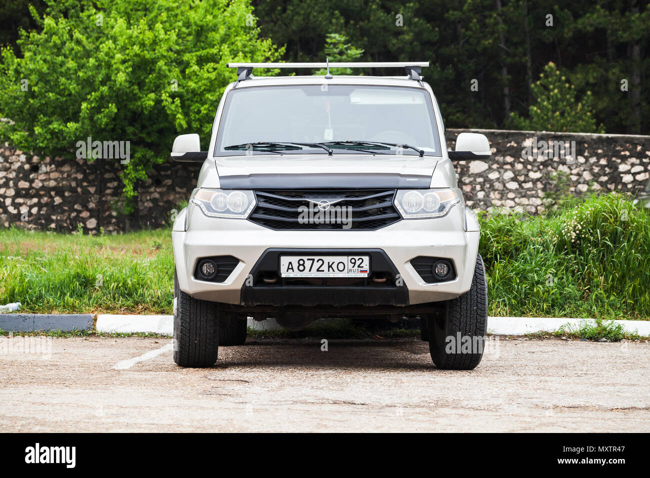 Sevastopol, Crimea - May 8, 2018: Close-up front view of UAZ Patriot or UAZ-3163, mid-size SUV produced by UAZ division of SeverstalAvto in Ulyanovsk, Stock Photo