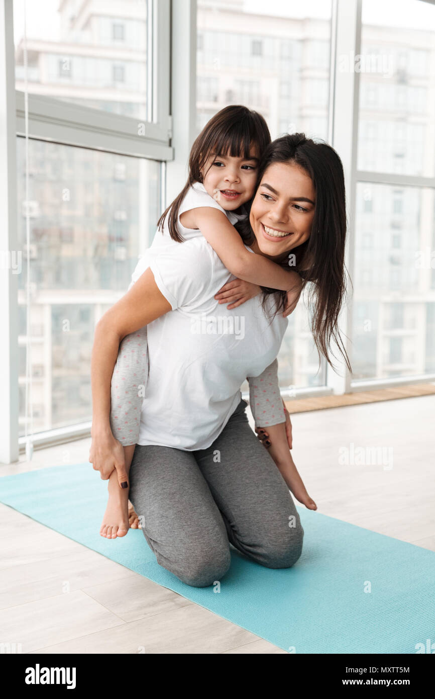 Photo of cheerful family mother and child having fun while woman