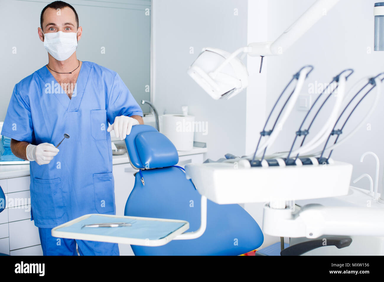 male Dentist is ready to accept client in clinic Stock Photo Alamy