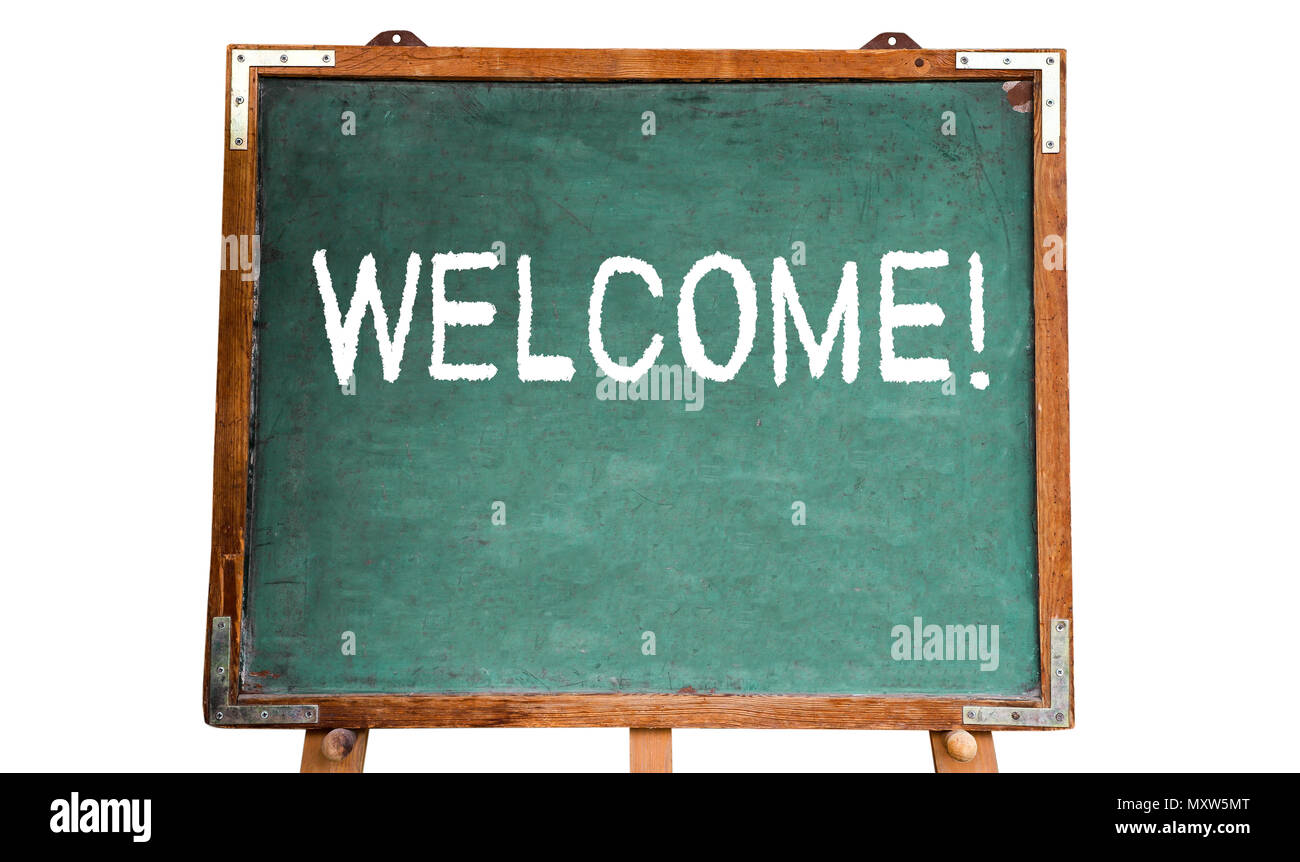 Welcome! text message in white chalk written on a school green old grungy vintage wooden chalkboard or blackboard with frame and stand isolated on whi Stock Photo