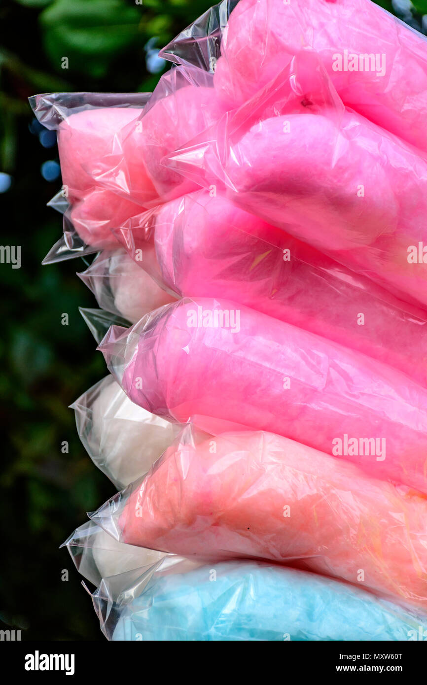 Bags with cotton candy of various colors during an afternoon in the park Stock Photo