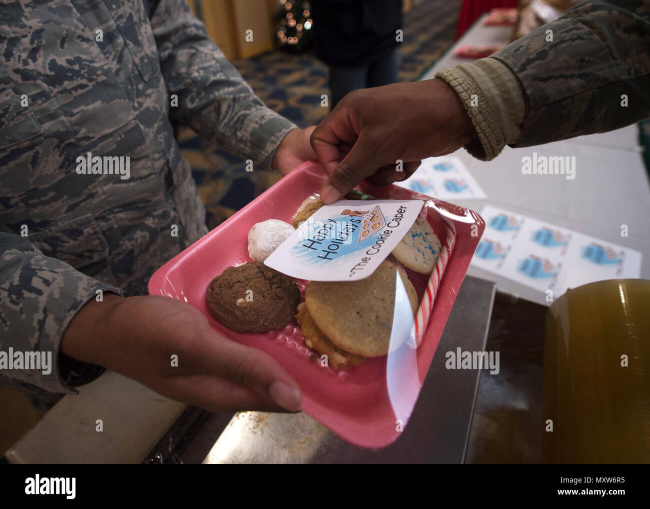 U.S. Air Force Airmen package cookies for delivery during the annual Cookie Caper event at Misawa Air Base, Japan, Dec. 7, 2016. After the cookies are divided and packaged, first sergeants and other leadership across the base hand delivered them to their units.  (U.S. Air Force photo by Senior Airman Deana Heitzman) Stock Photo